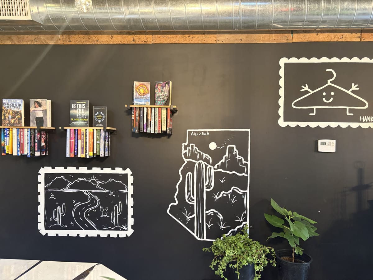 Interior of The Thread PHX featuring Arizona murals and bookshelves